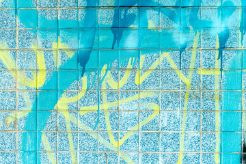 Blue exterior wall background with different graffiti overlays