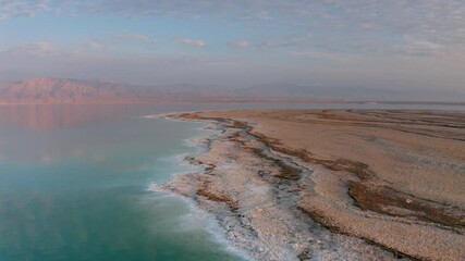 Incredible aerial view on the dead sea with beautiful mountains near sunset