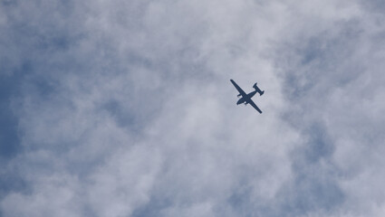 military transport plane against the blue sky