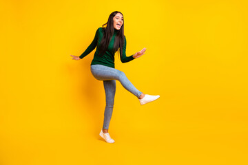 Fototapeta na wymiar Full size photo of young happy cheerful positive crazy funky funny girl dancing isolated on yellow color background