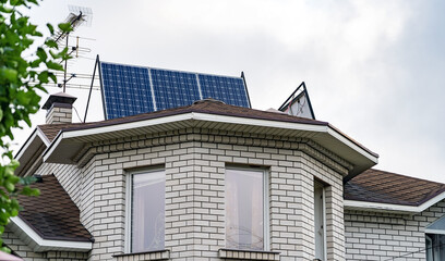 Solar photovoltaic panels on a house roof. Solar energy house company concept image. Solar Panels on Roof of Home