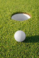 golfed ball on golf course of green grass - 468778318