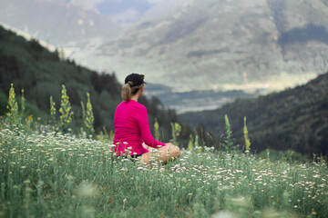 person sitting on a meadow