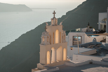 Landscapes of the village Fira with white bell tower in Santorini Island in Greece - obrazy, fototapety, plakaty