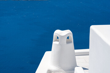 Close-up view of the roof chimney of traditional buildings in Santorini island, Greece