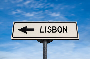 Lisbon road sign, arrow on blue sky background. One way blank road sign with copy space. Arrow on a pole pointing in one direction. Travel to Lisbon.