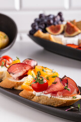 Bruschetta with tomatoes and prosciutto for dinner