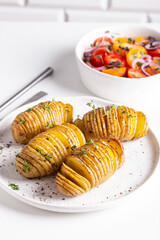 Grilled potato with thyme, pepper and sauce