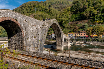 The railway next to the Ponte della Maddalena or del Diavolo, Borgo a Mozzano, Lucca, Italy