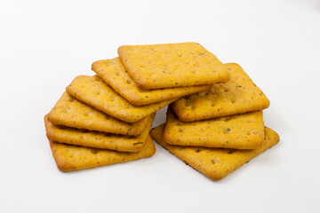 Crackers with bran and spicy herbs. Isolated on white background.
