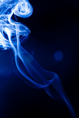 Motion blue smoke on black background.