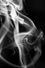 Fototapeta premium White smoke motion on black background.