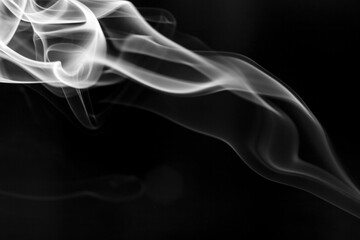 White  smoke motion on black background.