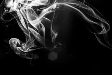 White  smoke motion on black background.