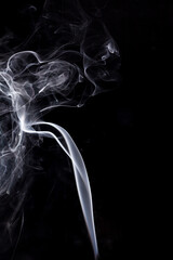 White smoke on black background.