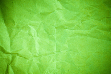 Vignette green crumpled paper.