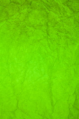 Green paper crumpled texture background.
