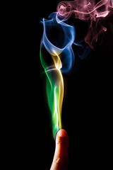 Colorful smoke out of fingers.