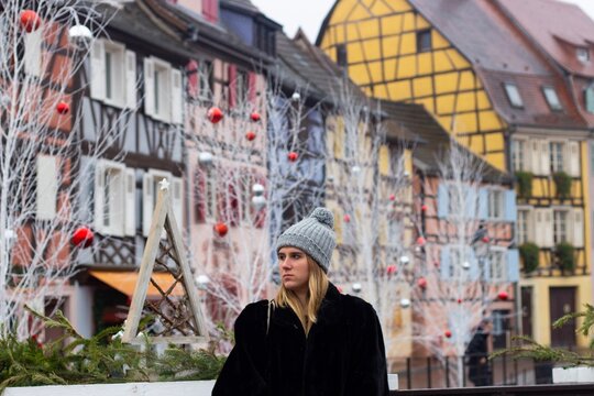 woman traveling in colmar, alsace at christmas