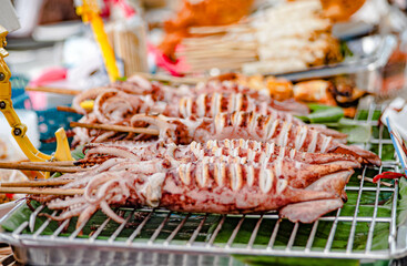 Charcoal grilled egg squid for sale on the beach in Won Bangsaen, Thailand