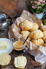 Cross buns. Wooden background, side view, coffee.