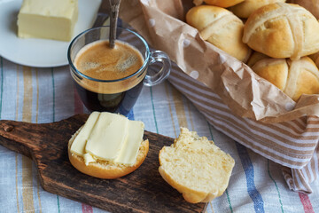 Cross buns. Wooden background, side view, coffee.