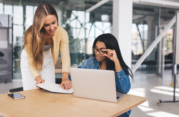 Business women working in open space office