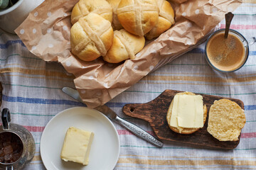 Cross buns. Wooden background, side view, coffee.