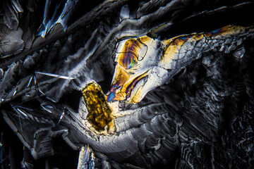 Colorful crystals under microscope, polarization colors, polar filters