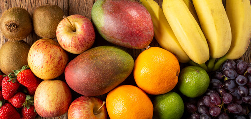 Naklejka na ściany i meble Assortment of fresh fruits on the table.