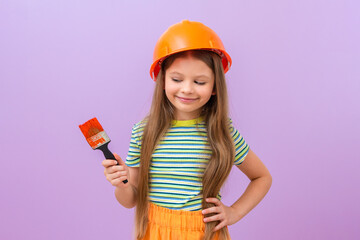 Renovation in the children's room. A little girl is going to paint the walls in the bedroom.