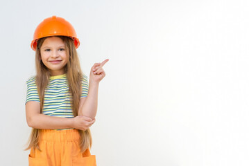Renovation in the children's room. The little girl points her finger to the side.