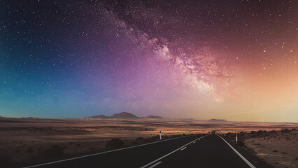 Beautiful view of the empty road with the Milky Way in the background.