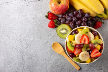 Fruit salad in bowl on the table.