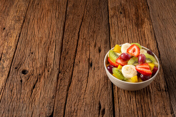Fototapeta na wymiar Fruit salad in bowl on the table.