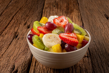 Fruit salad in bowl on the table.