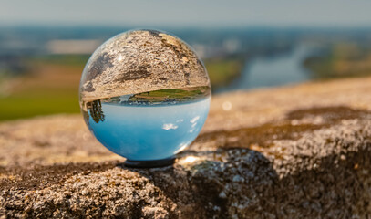 Fototapeta na wymiar Crystal ball landscape shot at the famous Bogenberg, Danube, Bavaria, Germany