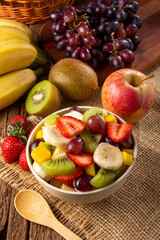 Fruit salad in bowl on the table.