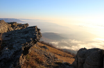 Sunrise in the mountains. Orange slopes of mountains and rocks
