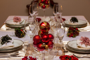 Christmas dining table with decorative ornaments for Christmas day lunch. 25th december Chritsmas...