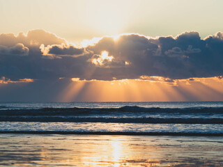 Sunset sky clouds background. Beautiful landscape with clouds and orange sun on sky. High quality photo