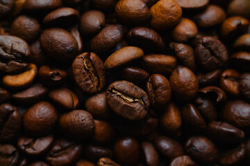 Coffee beans in flat lay. Pile of roasted caffeine grains shot directly from above.