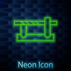 Glowing neon line Parking car barrier icon isolated on brick wall background. Street road stop border. Vector