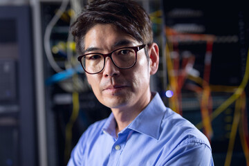 Portrait of asian male engineer in computer server room