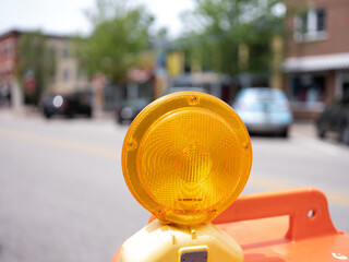 Graphic image of a construction barricade yellow round light