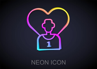 Glowing neon line Football or soccer player icon isolated on black background. Vector
