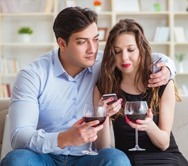 Young pair drinking wine in romantic concept