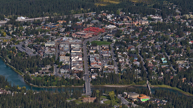 Beautiful high angle view of Banff downtown in Banff National Park, Alberta, Canada in the Rocky Mountains in autumn with Bow River and main street.