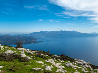 A panoramic of the sea and islands on top of a mountain in Greece.