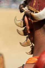 Abstract Portrait of a Naga tribesman from rear dressed in traditional warrior attire at Kohima Nagaland India on 4 December 2016  © Sandeep
